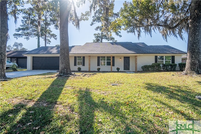 single story home with a garage and a front lawn