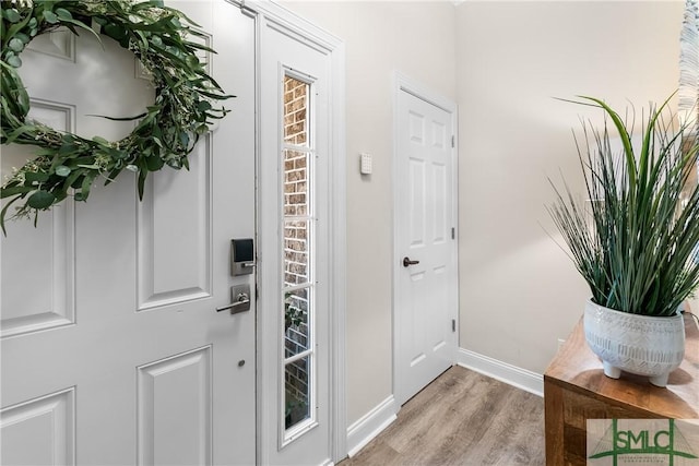 2203 River Oaks Dr, Richmond Hill, GA 31324 - foyer entrance featuring baseboards and light wood finished floors