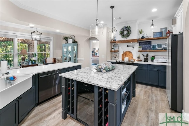 2203 River Oaks Dr, Richmond Hill, GA 31324 - kitchen with stainless steel appliances, open shelves, a center island, visible vents, and wine cooler