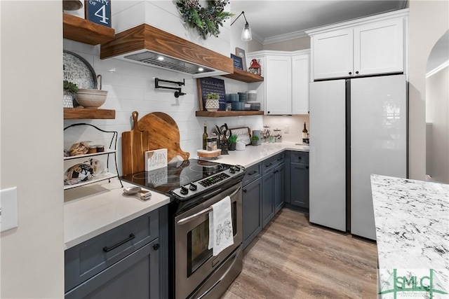 2203 River Oaks Dr, Richmond Hill, GA 31324 - kitchen with white cabinets, refrigerator, open shelves, and electric range