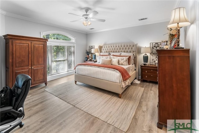 2203 River Oaks Dr, Richmond Hill, GA 31324 - bedroom featuring visible vents, crown molding, light wood-style flooring, and a ceiling fan