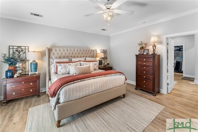 2203 River Oaks Dr, Richmond Hill, GA 31324 - bedroom with ornamental molding, visible vents, wood finished floors, and baseboards