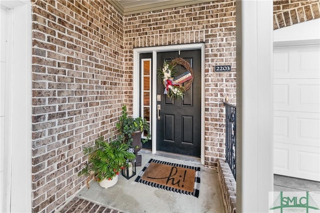 2203 River Oaks Dr, Richmond Hill, GA 31324 - doorway to property featuring a porch and brick siding