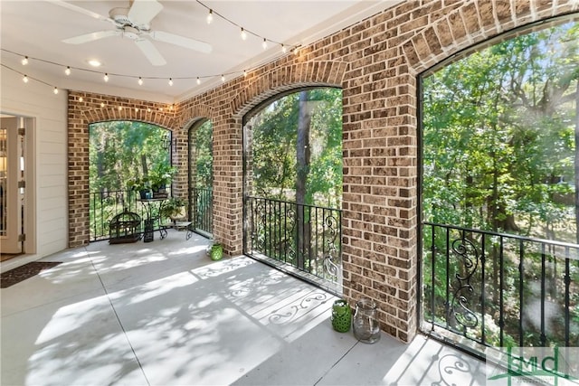 2203 River Oaks Dr, Richmond Hill, GA 31324 - unfurnished sunroom featuring rail lighting