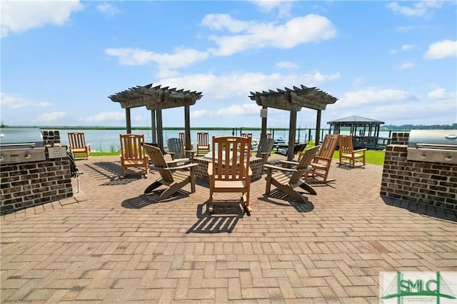 2203 River Oaks Dr, Richmond Hill, GA 31324 - view of patio / terrace featuring a gazebo, a pergola, a water view, and grilling area