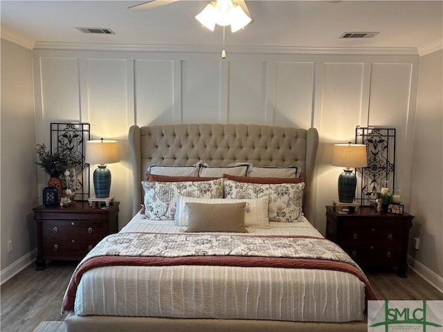 2203 River Oaks Dr, Richmond Hill, GA 31324 - bedroom featuring wood finished floors, visible vents, crown molding, and baseboards