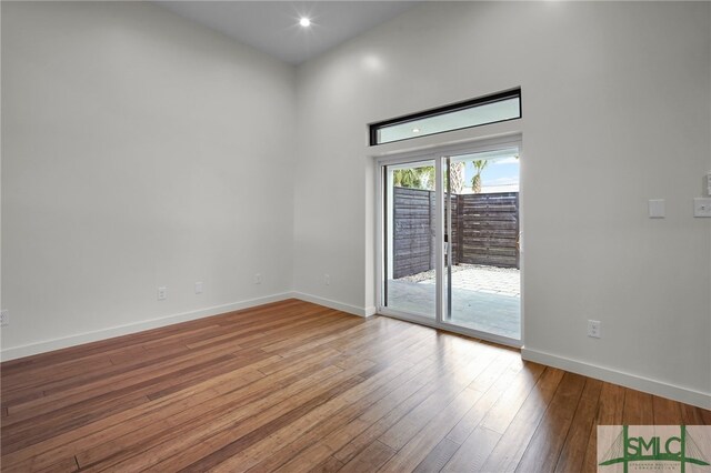 unfurnished room featuring hardwood / wood-style floors