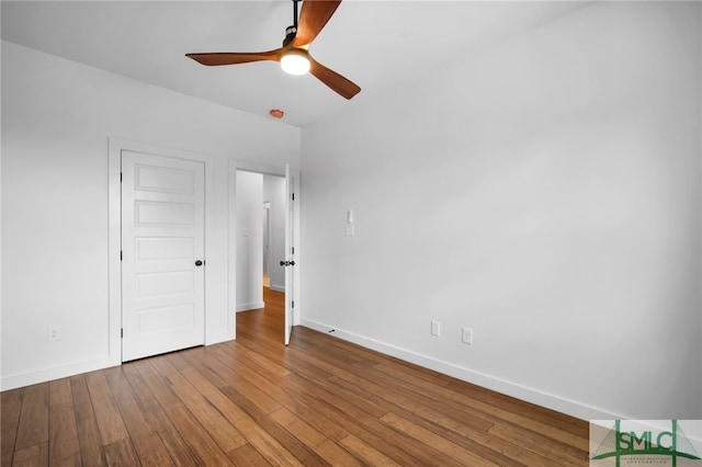 unfurnished bedroom featuring wood-type flooring and ceiling fan