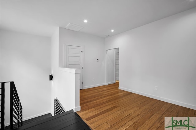 unfurnished room with hardwood / wood-style floors