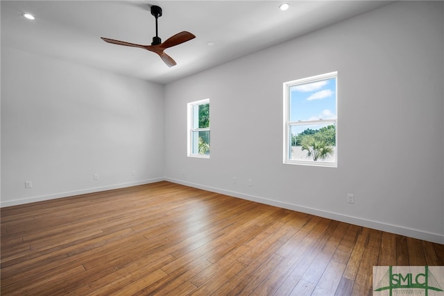 unfurnished room featuring hardwood / wood-style floors and ceiling fan