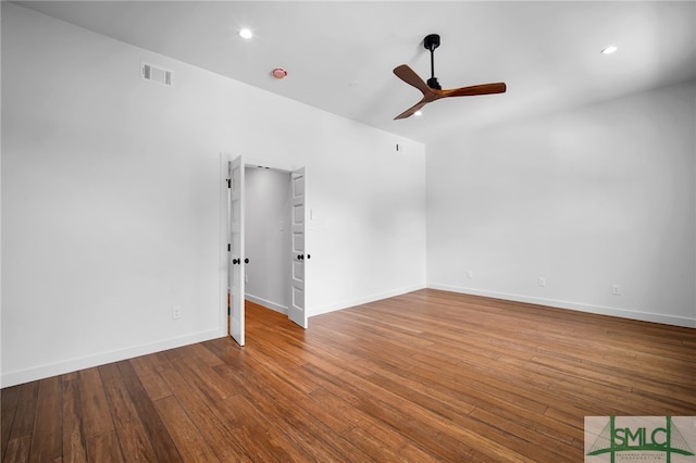 spare room with wood-type flooring and ceiling fan