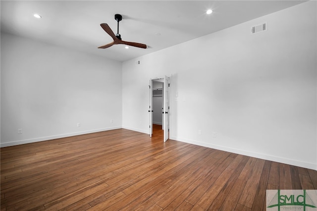 spare room with ceiling fan and hardwood / wood-style flooring