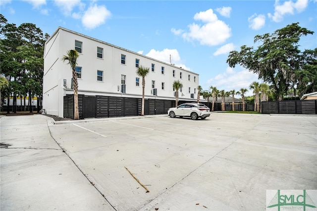 view of vehicle parking with a garage