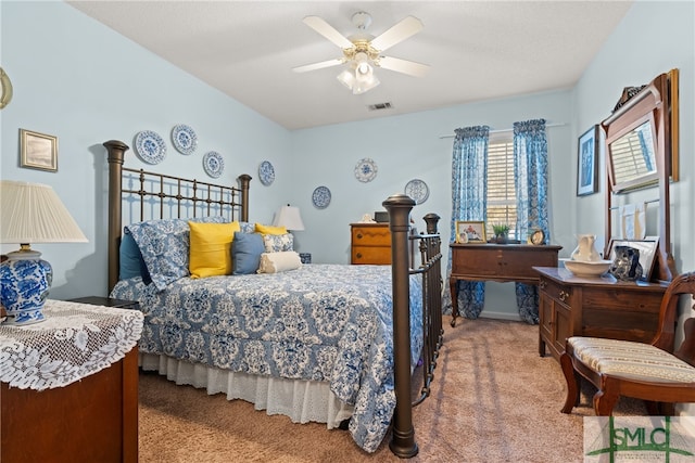 carpeted bedroom featuring ceiling fan