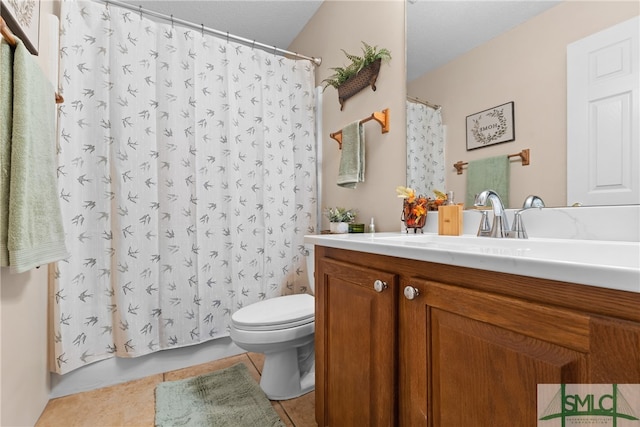 bathroom with toilet, curtained shower, vanity, and tile patterned floors