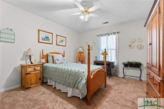 bedroom with light carpet, a textured ceiling, and ceiling fan