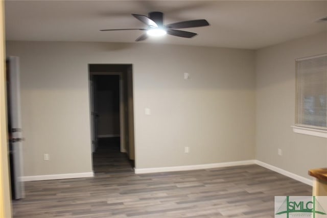 empty room with ceiling fan and light hardwood / wood-style floors