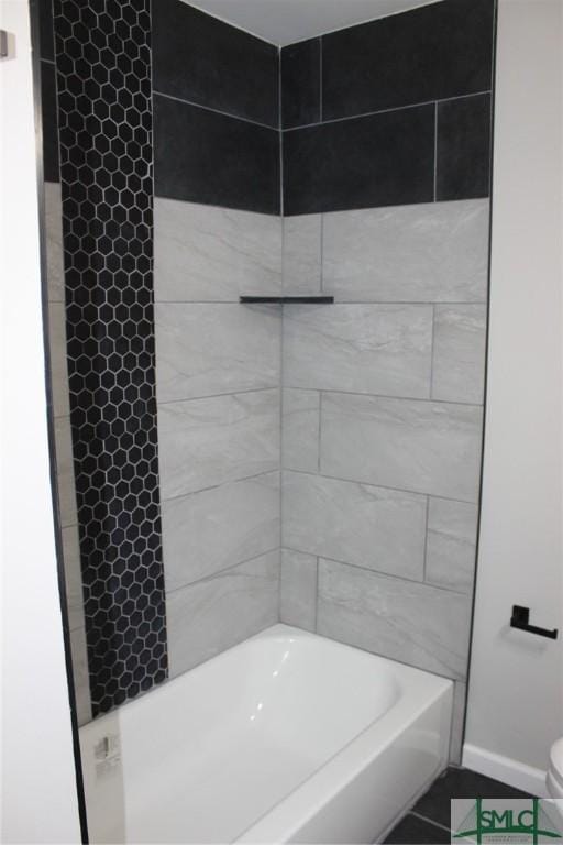 full bath featuring tile patterned flooring and baseboards