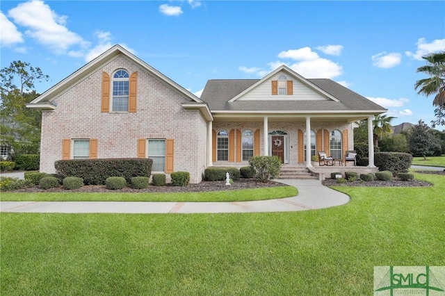 view of front facade with a porch and a front yard