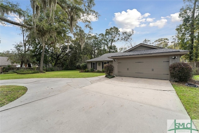 ranch-style house with a garage and a front yard