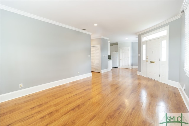 unfurnished living room with light hardwood / wood-style floors and ornamental molding