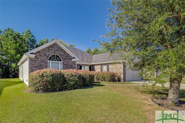 ranch-style house with a front yard and a garage