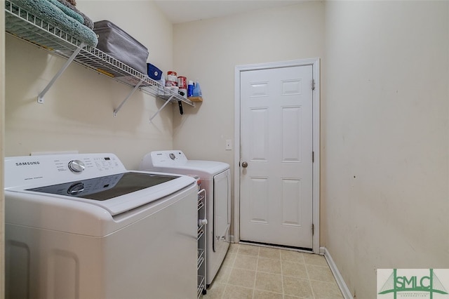 washroom featuring washing machine and dryer