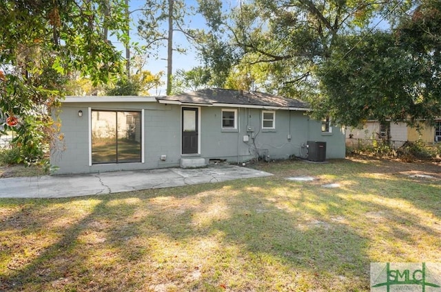 back of house with a yard, a patio, and central air condition unit