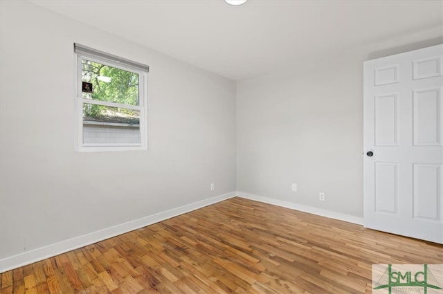 empty room featuring hardwood / wood-style floors