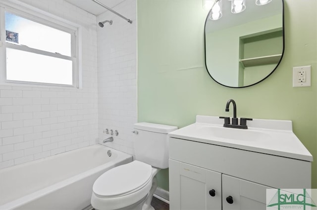 full bathroom featuring vanity, toilet, and tiled shower / bath combo