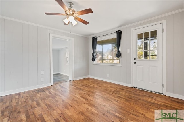 interior space featuring hardwood / wood-style floors and ornamental molding