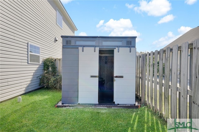 view of outdoor structure featuring a yard