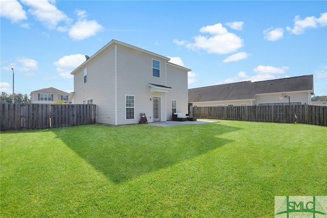 back of property with a patio area and a lawn