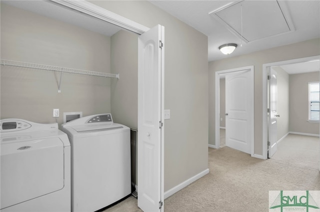 washroom featuring light carpet and independent washer and dryer