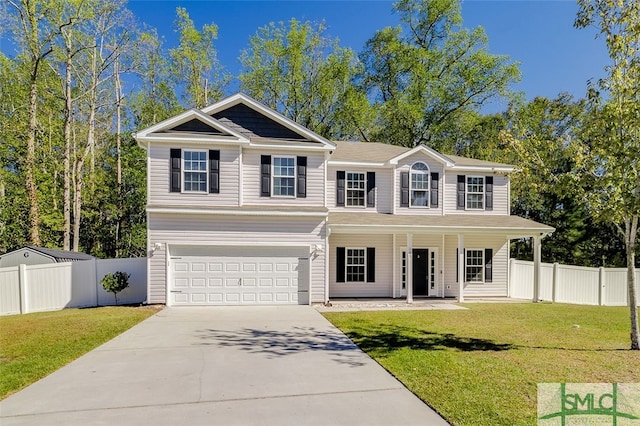 view of front of house with a front yard and a garage