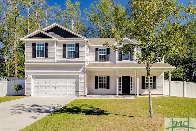 view of front of house with a front lawn and a garage