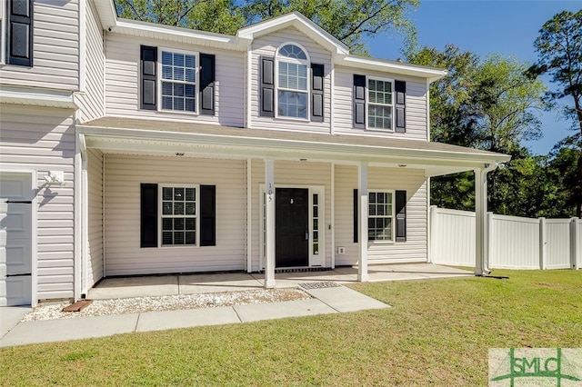 view of front of house with a porch and a front lawn