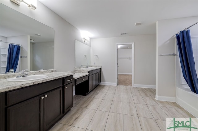 bathroom featuring vanity and shower / tub combo with curtain