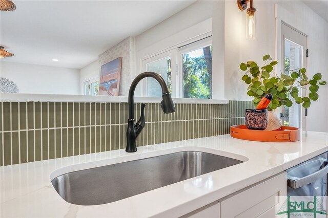 room details with white cabinets and sink