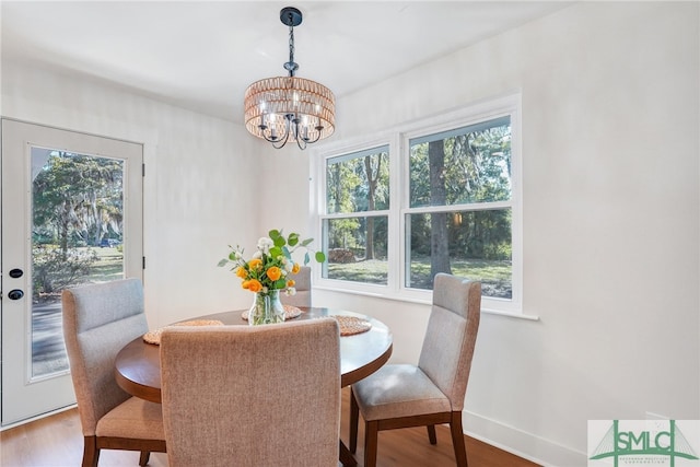 dining room featuring a notable chandelier and wood-type flooring