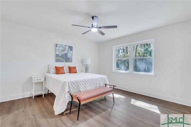 bedroom featuring light hardwood / wood-style floors and ceiling fan