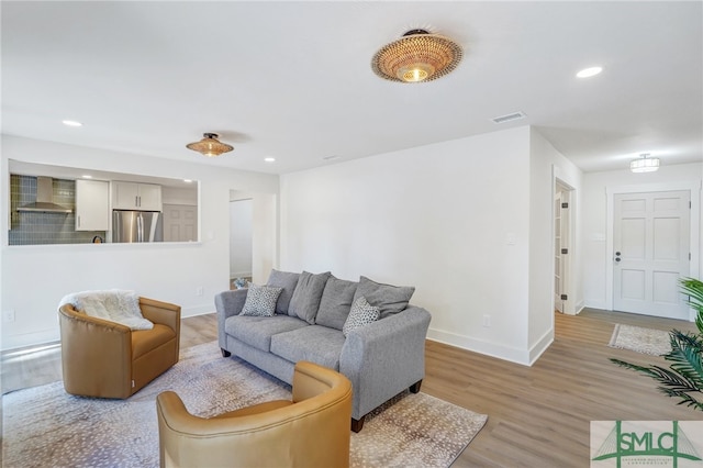 living room with light hardwood / wood-style floors