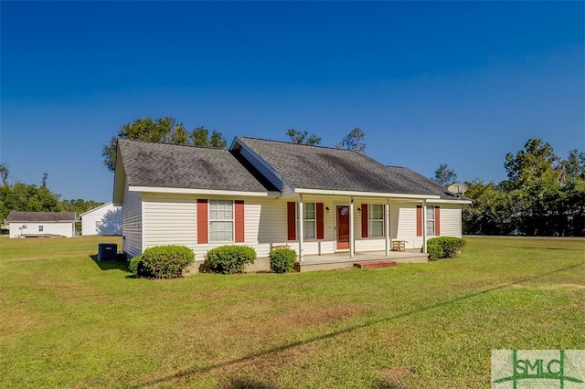 ranch-style home featuring a front yard and covered porch