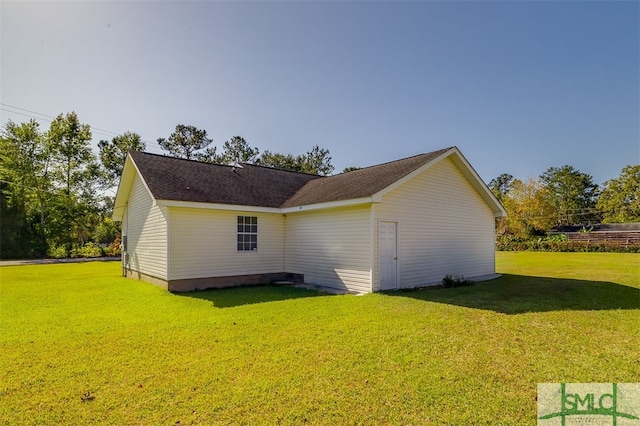 view of property exterior with a lawn