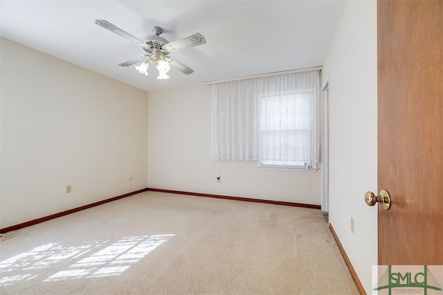 carpeted empty room with ceiling fan