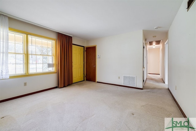 empty room with light colored carpet