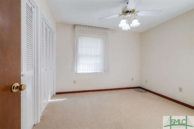 unfurnished bedroom featuring carpet floors and ceiling fan