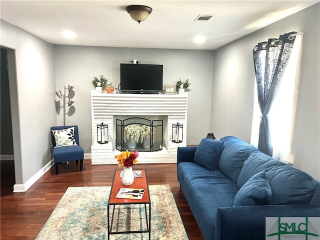 living room with dark hardwood / wood-style flooring