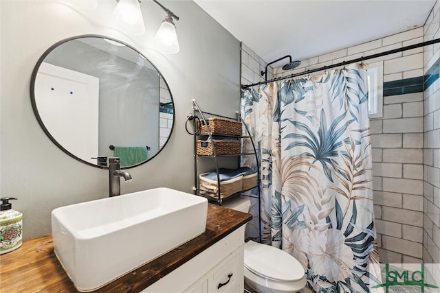 bathroom featuring vanity, hardwood / wood-style floors, curtained shower, and toilet