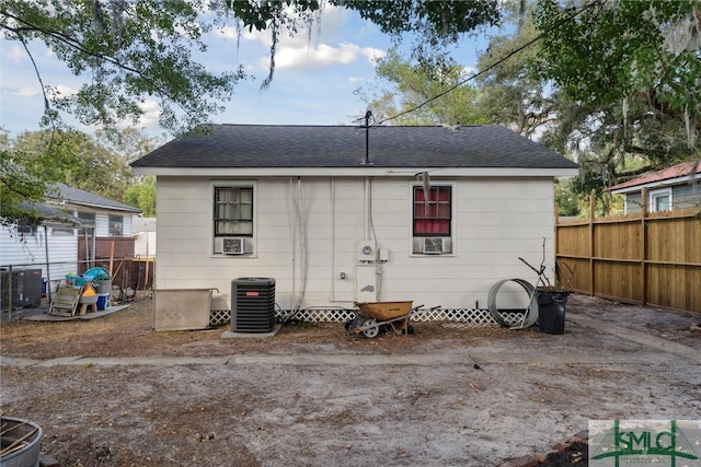 back of house with central air condition unit and cooling unit